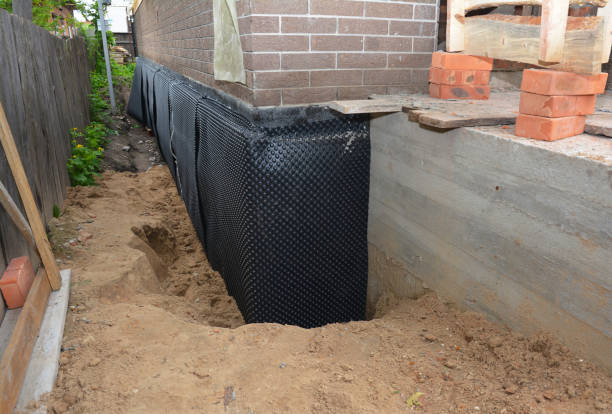 Happy homeowners after waterproofing job in Vernon